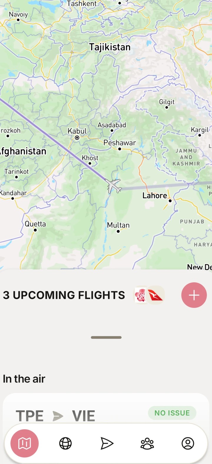 Wheels Up showing a plane in flight over Afghanistan and Pakistan on the live map, with an In the air card for a flight from Taipei to Vienna
